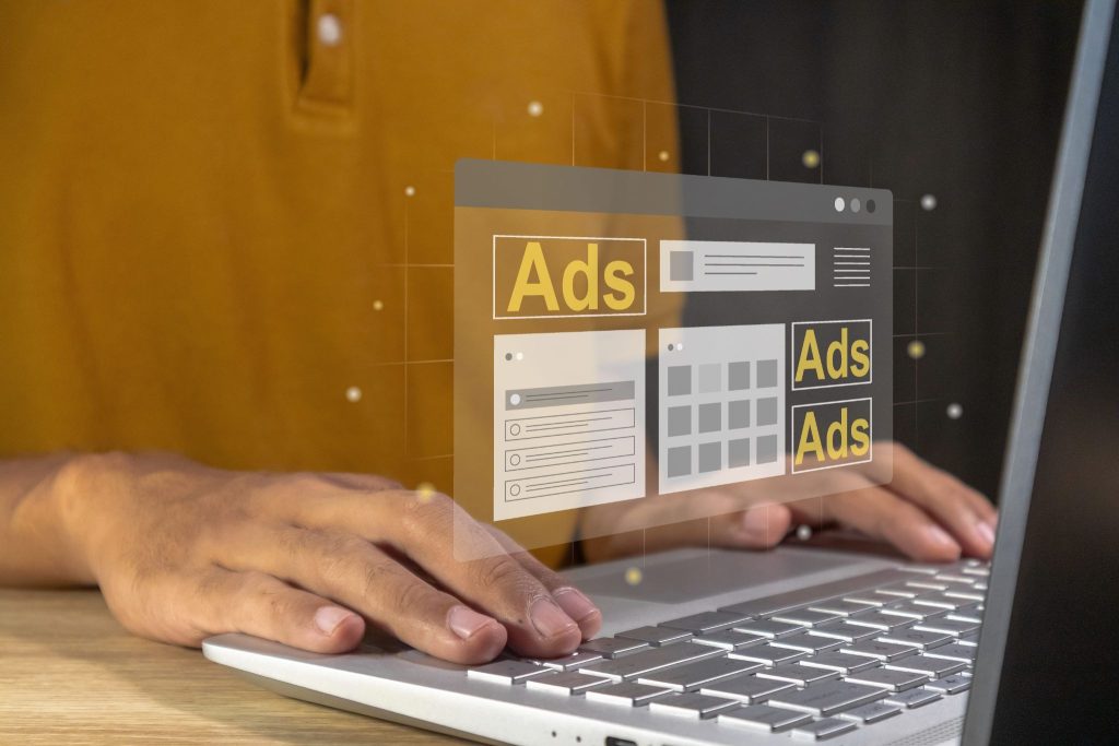 ads infrographic in front of a comptuer 