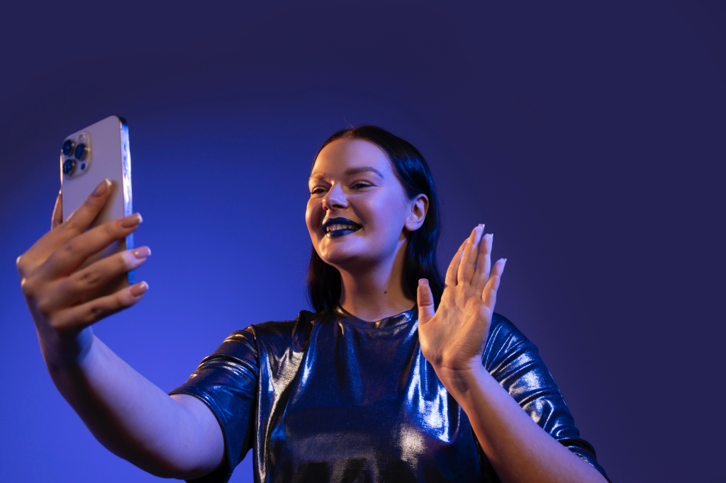 purple background and someone filming 